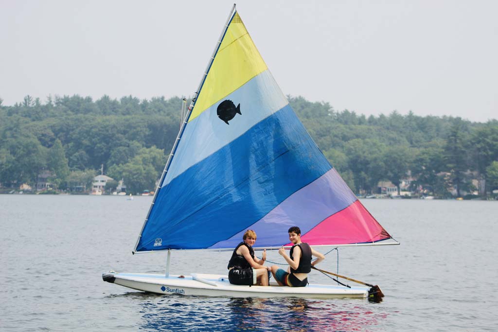 Campers sail on the lake